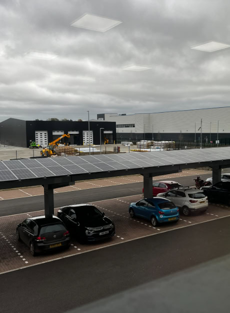 Commercial rooftop solar panel installation under a clear blue sky, showcasing renewable energy solutions for businesses. Solar PV system designed for efficient energy generation and sustainability.
